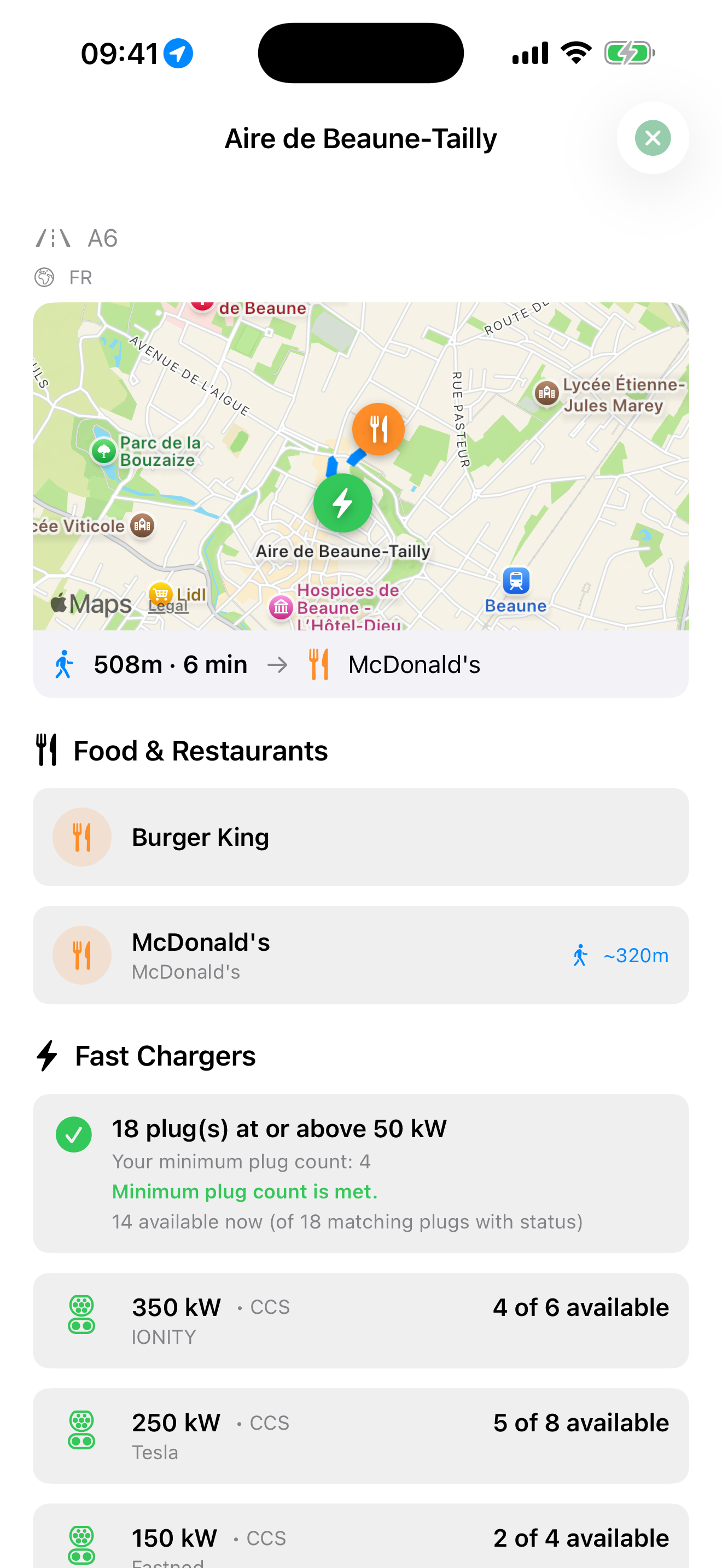 A charging stop showing chargers, power, availability, restrooms, and nearby food